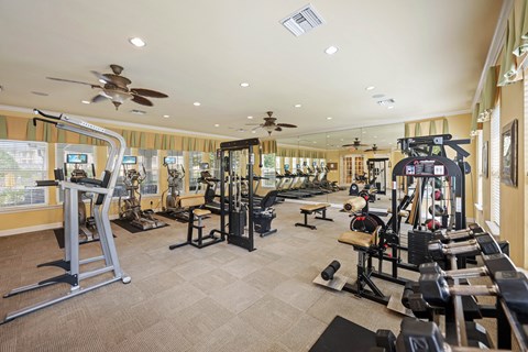 A fitness center with various fitness equipment