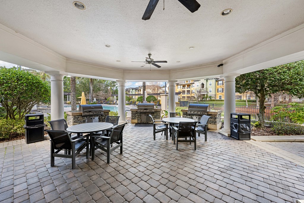 Exterior patio with several tables and chairs