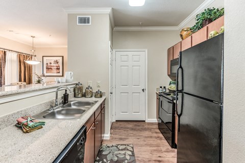 a kitchen with stainless steel appliances and granite counter tops