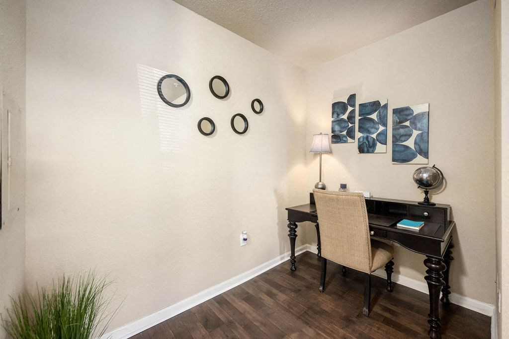 A room with a desk and a chair.