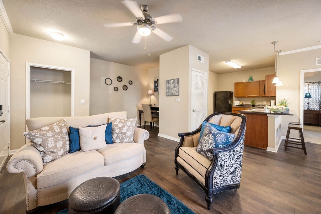 A living room with a couch and a chair.