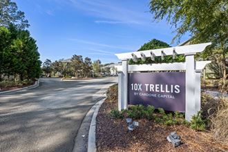 the sign for 107 trellis at the entrance of the community
