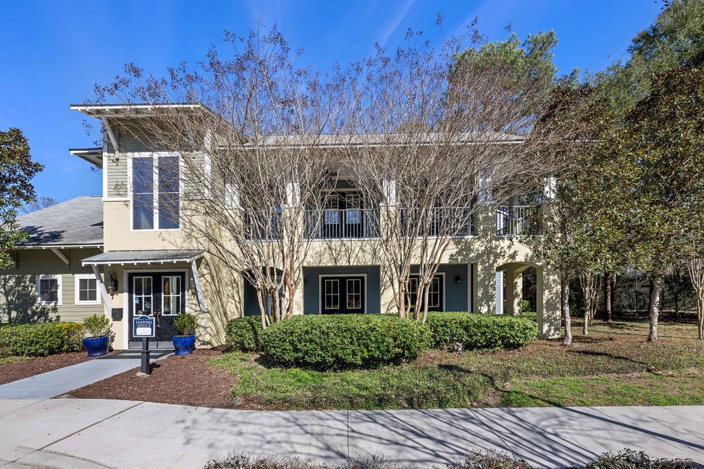 A house with a front yard and a driveway.