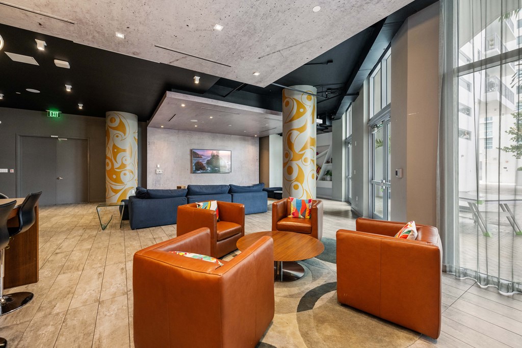 a large lobby with couches and chairs