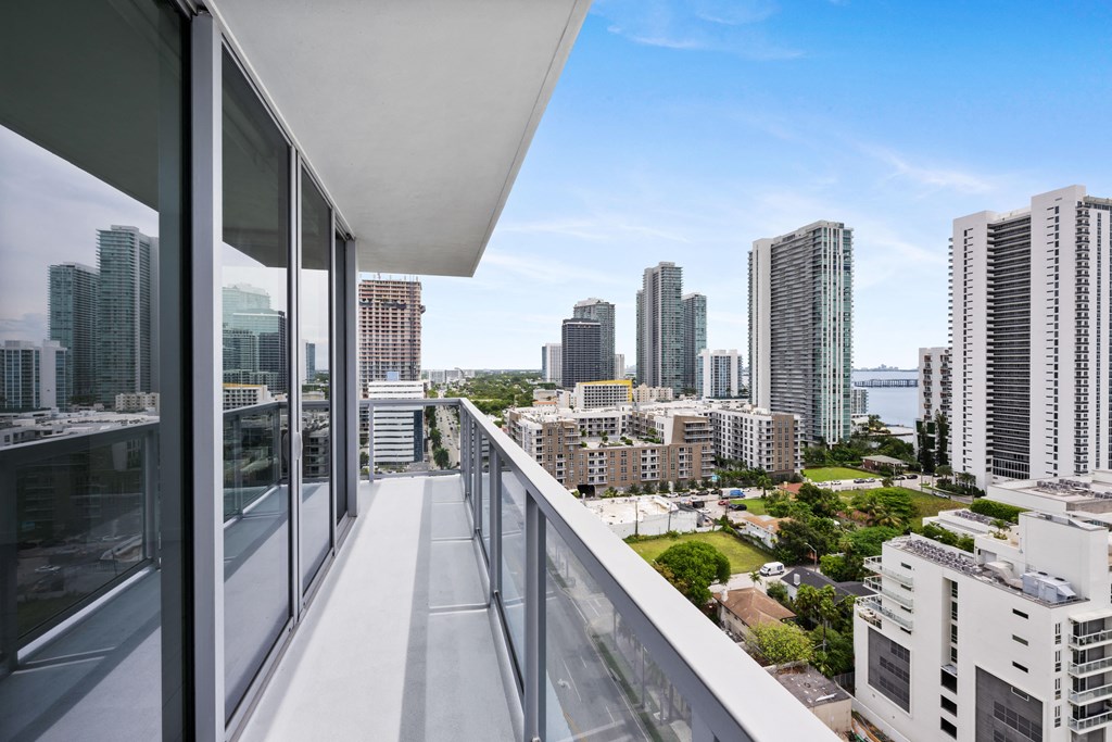a balcony with a view of the city