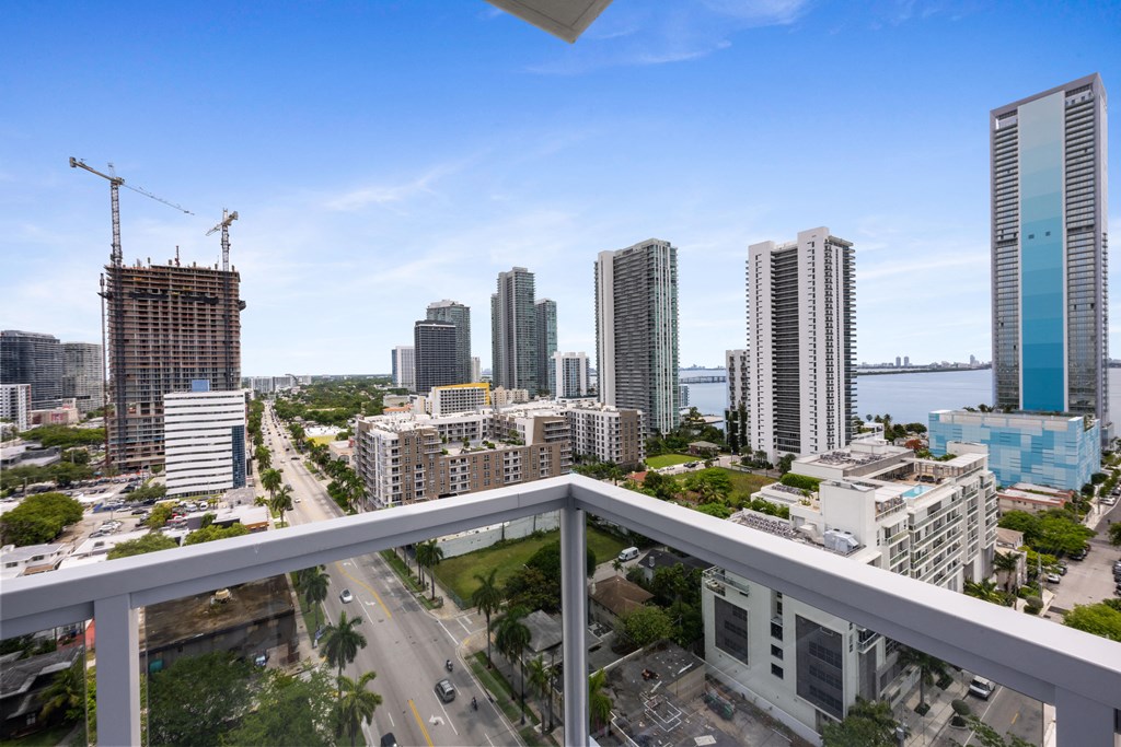 a view of the miami skyline from a balcony