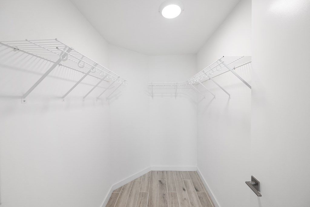 a room with white walls and a wooden floor