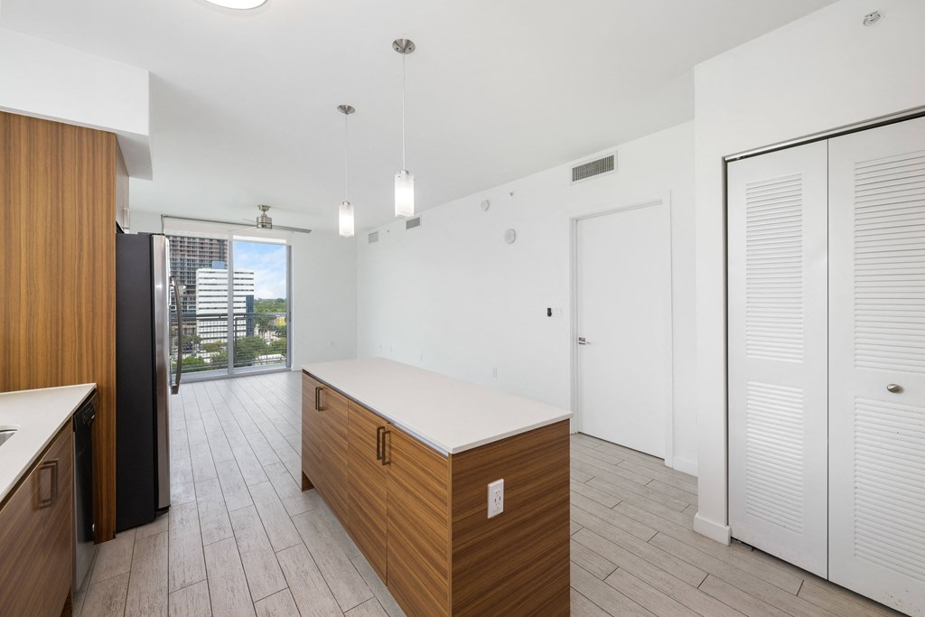 a kitchen and living room in a 555 waverly unit