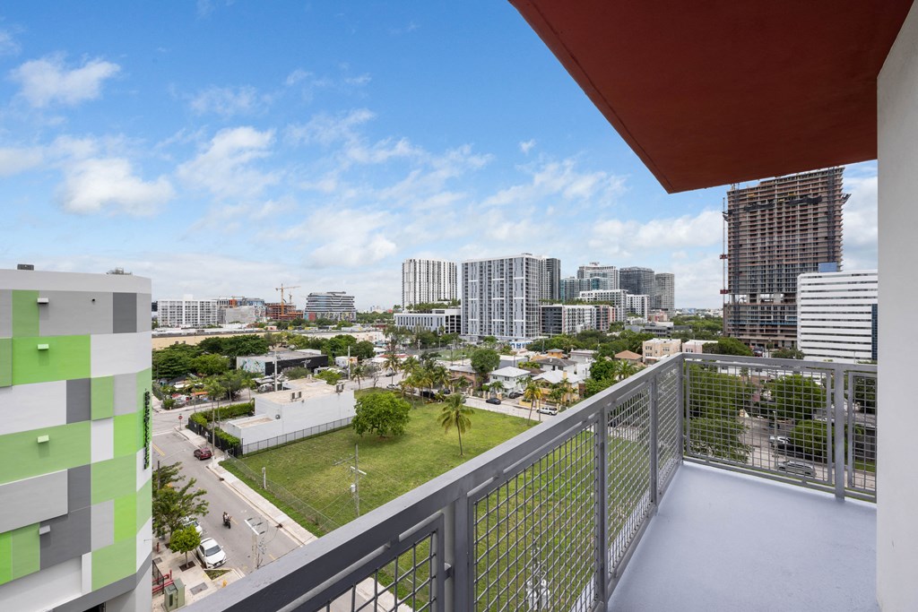 a balcony with a view of the city