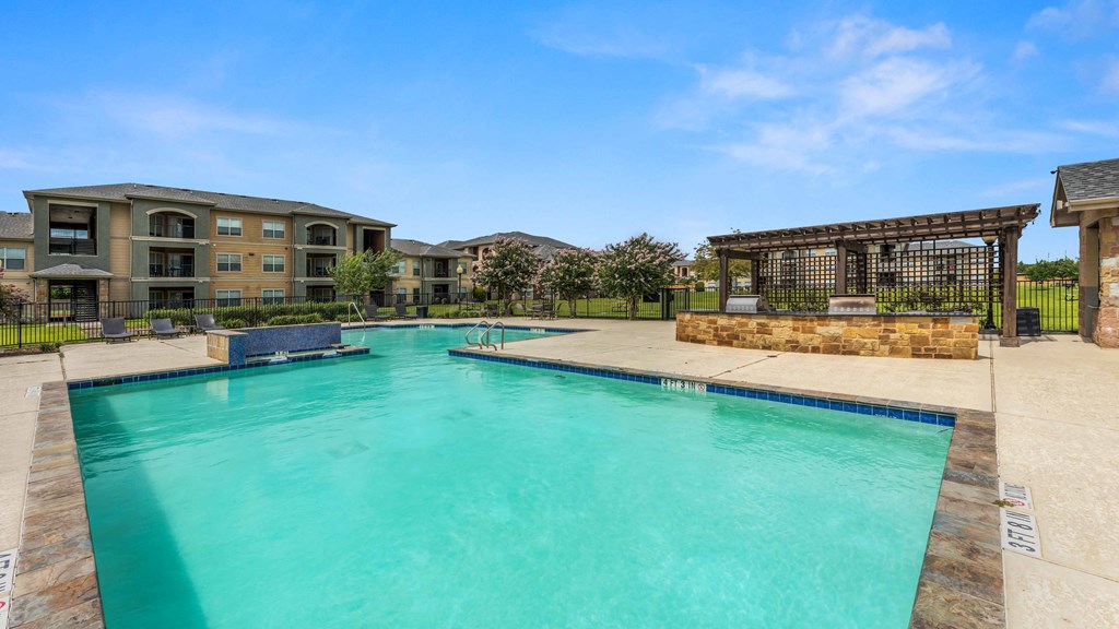 lounge chair view with pool side view aswell