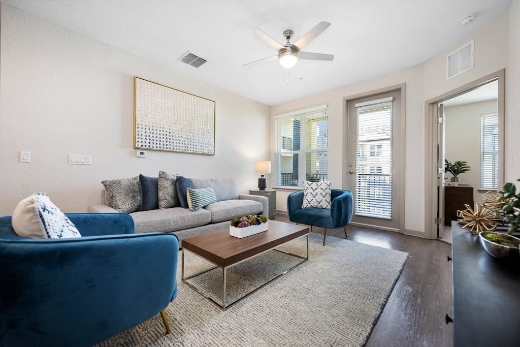 living room with white walls and a ceiling fan