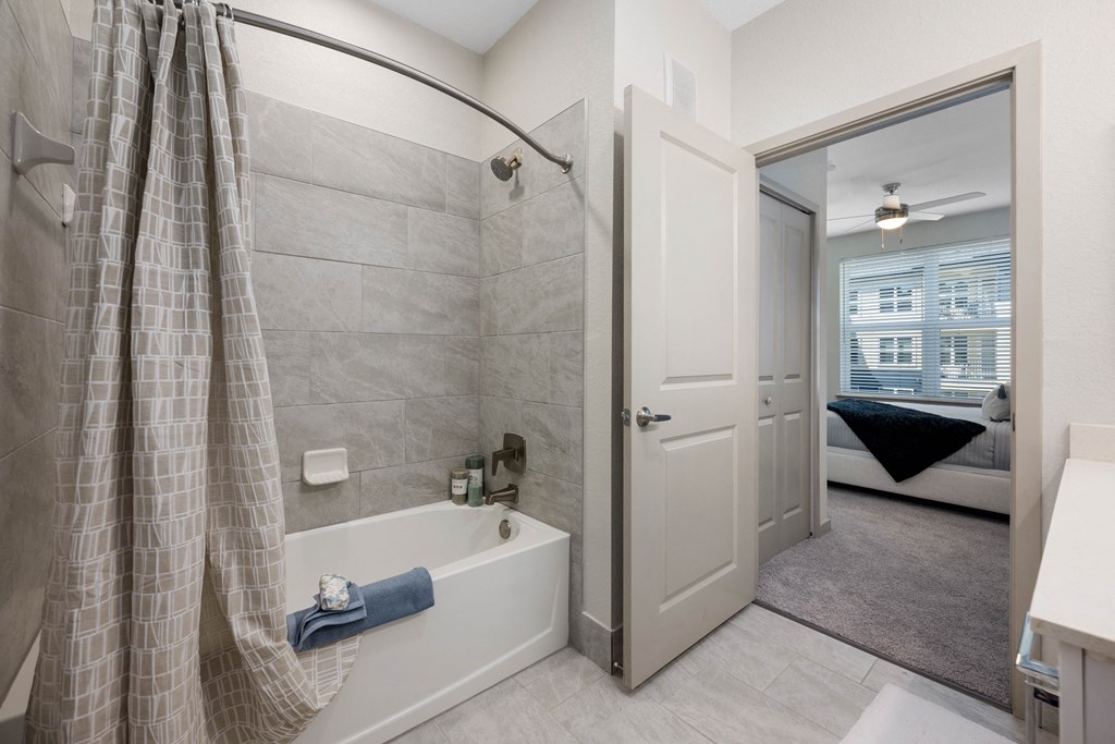 a bathroom with a shower and a bathtub