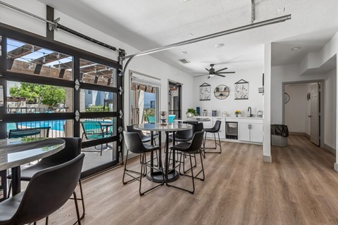 A dining area with a table and chairs is shown.