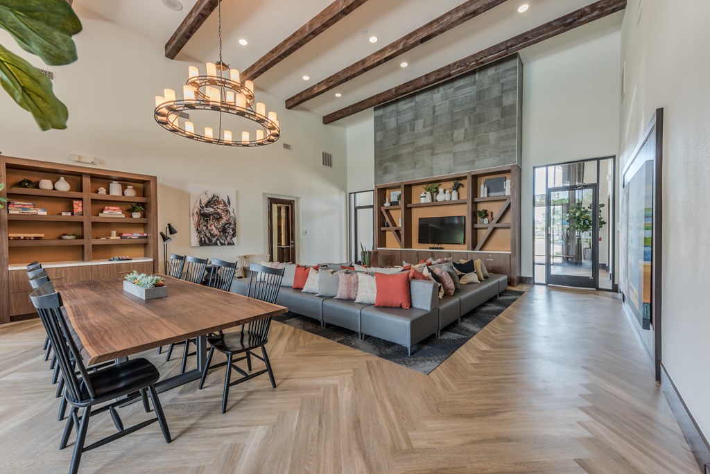 A modern dining room with a wooden table and chairs.