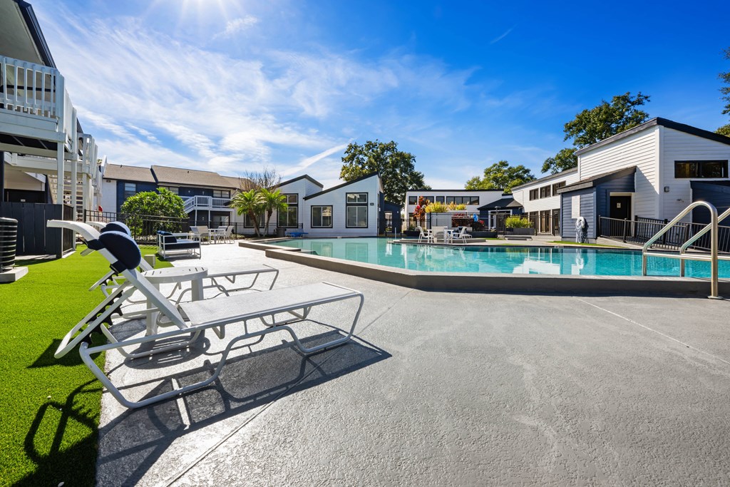 our apartments have a pool and lounge chairs in front of our buildings