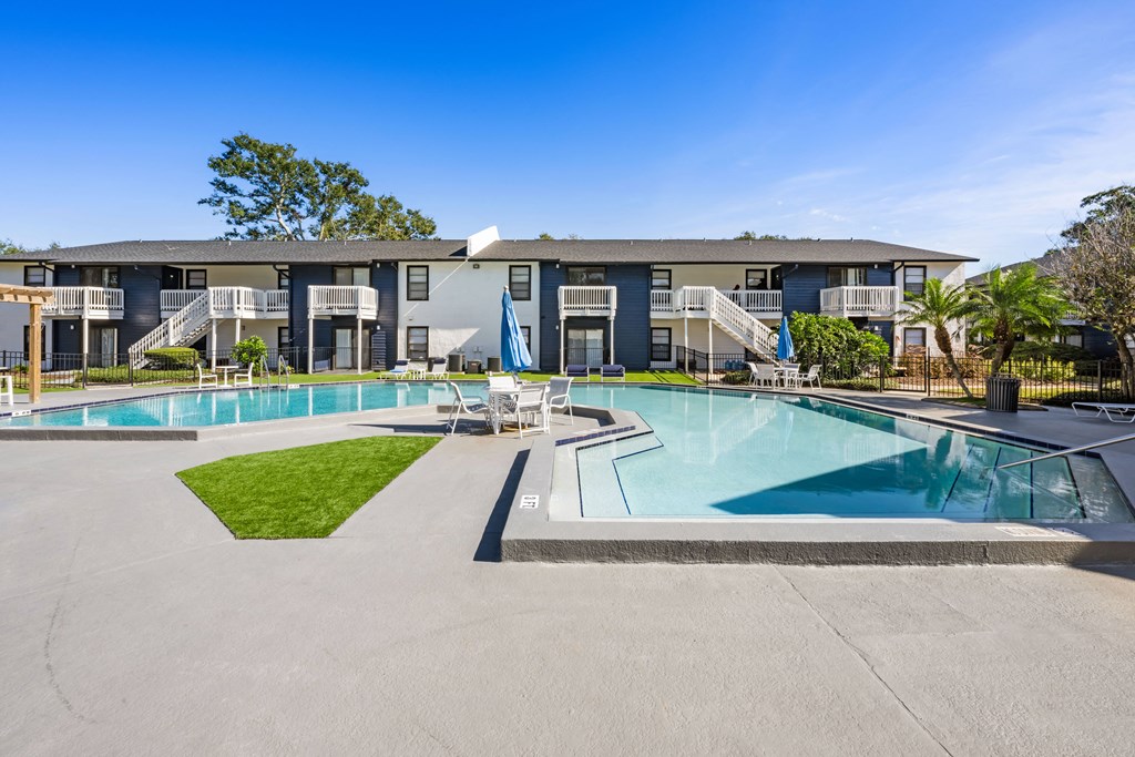 a swimming pool with a building in the background