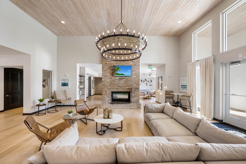 a living room with a large couch and a fireplace