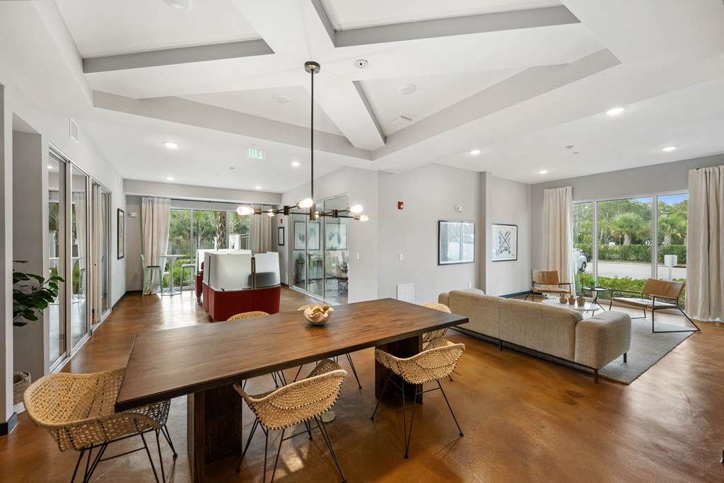 a living room with a dining room table and a couch