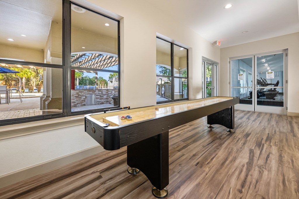 a pool table in a house with a view of the street