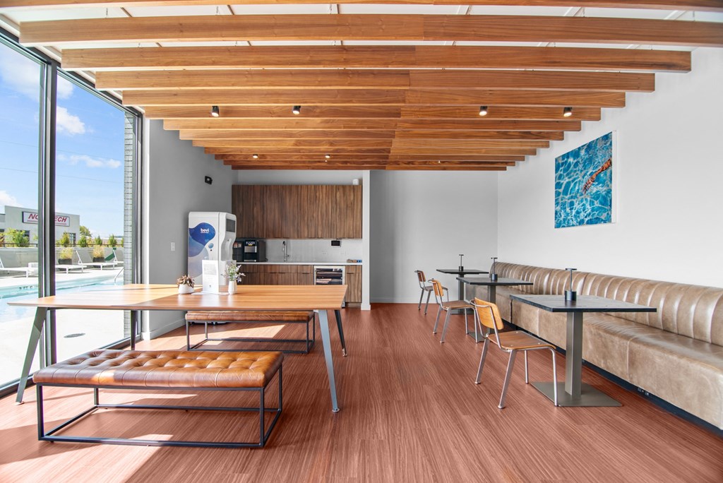 a dining room with wooden floors and a table and chairs