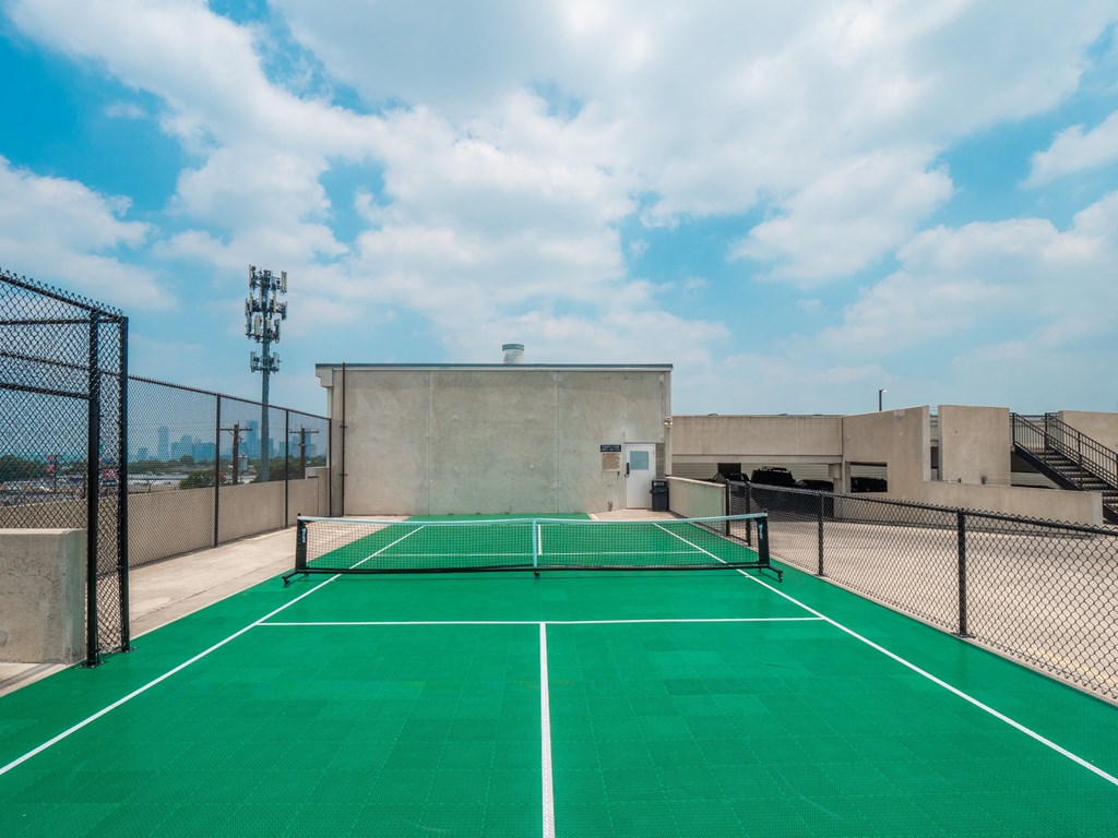 a tennis court on the roof of a building