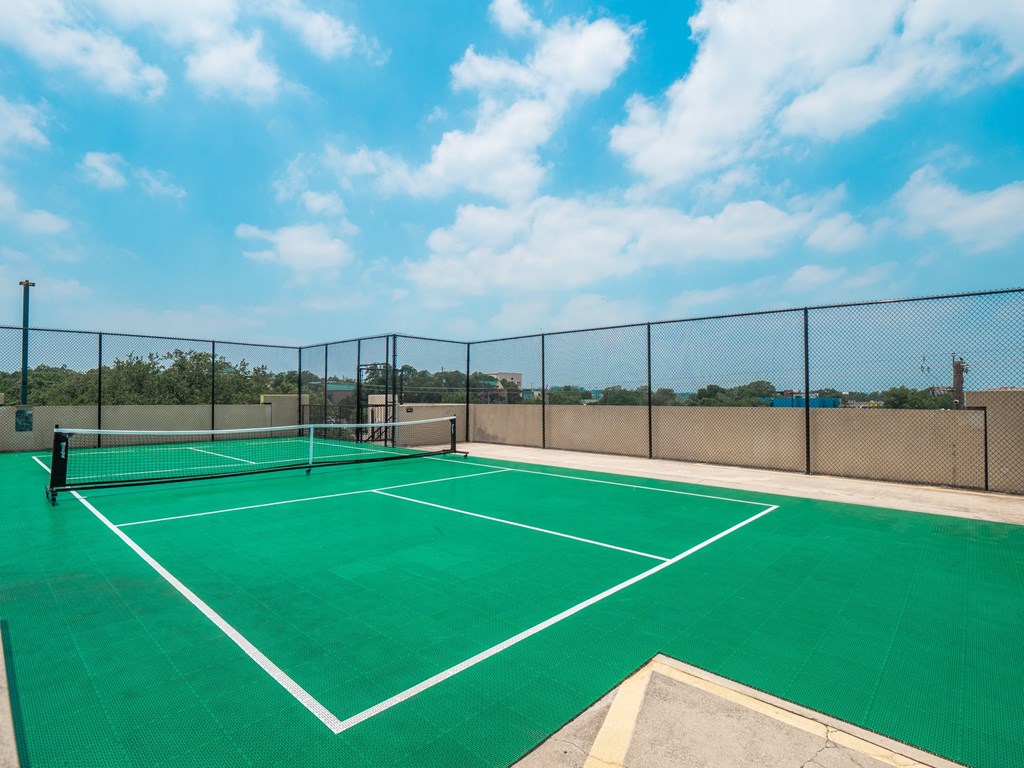 a tennis court on the roof of a building