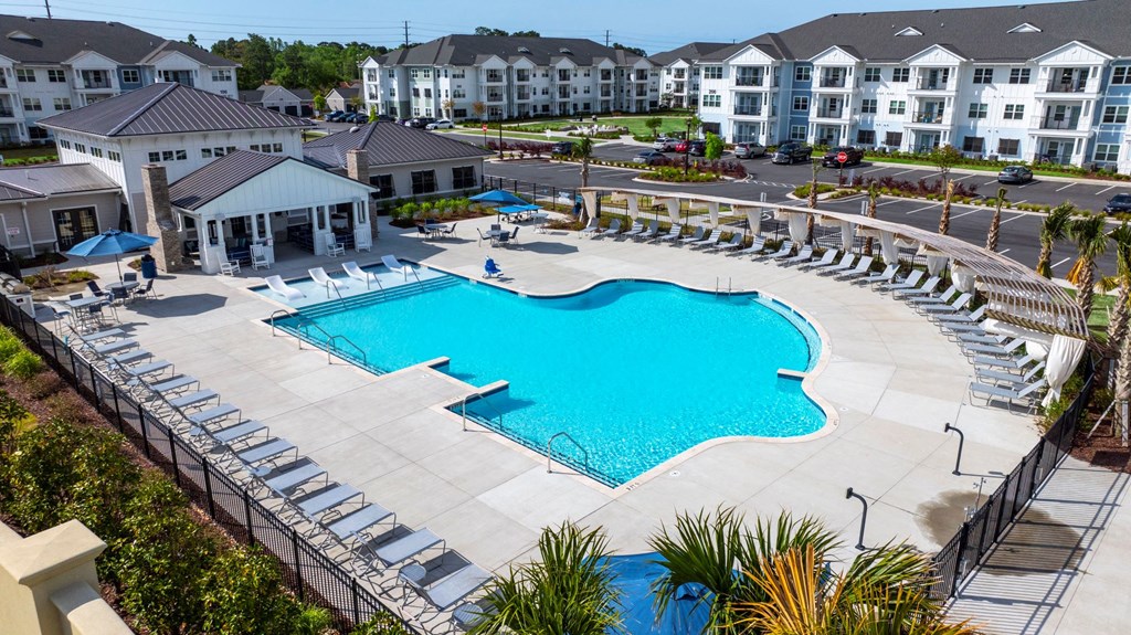 an aerial view of a swimming pool at an apartment complex
