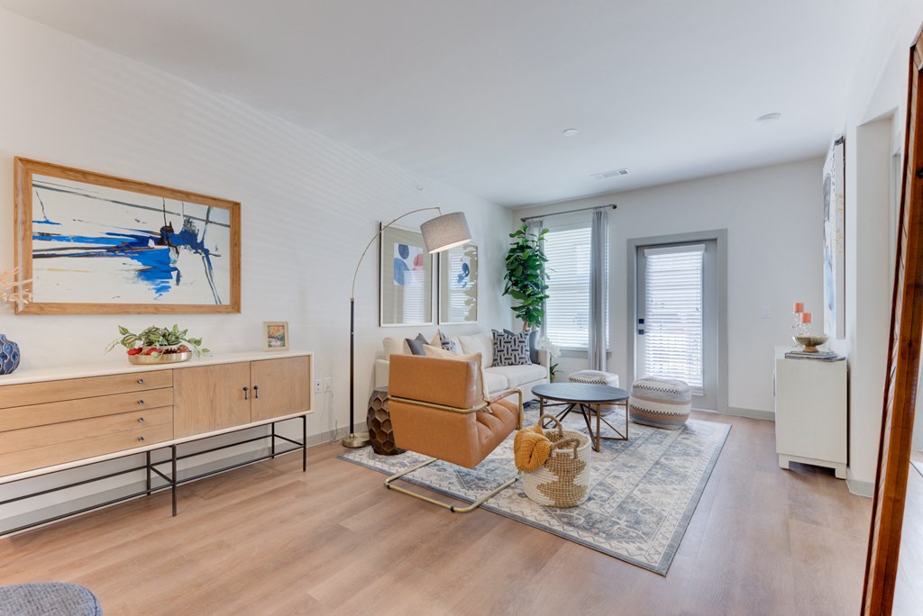 a living room with a couch and a chair and a table