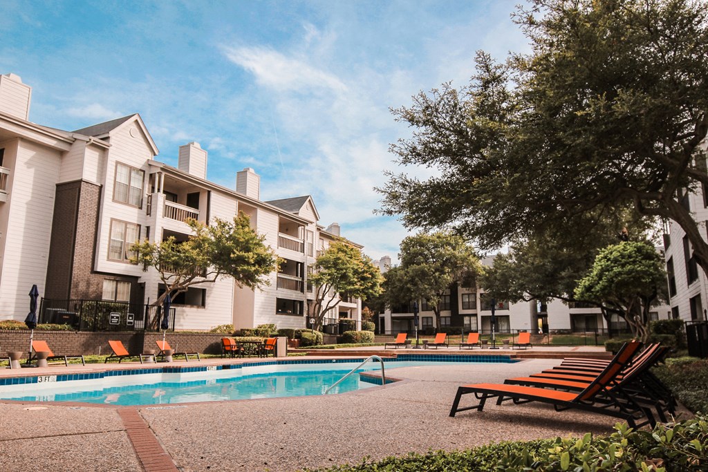 our apartments offer a swimming pool and a patio with chairs