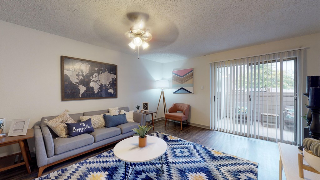 an open living room with a couch and a coffee table