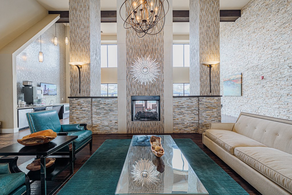 a living room with a white couch and a fireplace