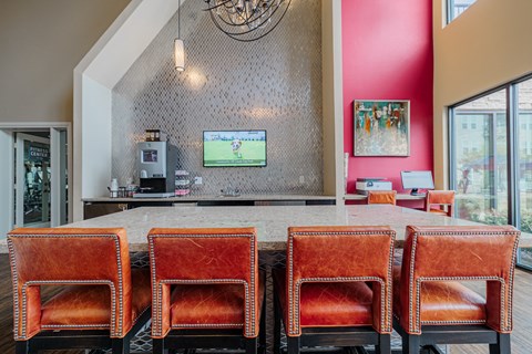 a dining room with a table and chairs and a television