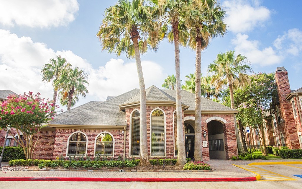 a house with palm trees in front of it