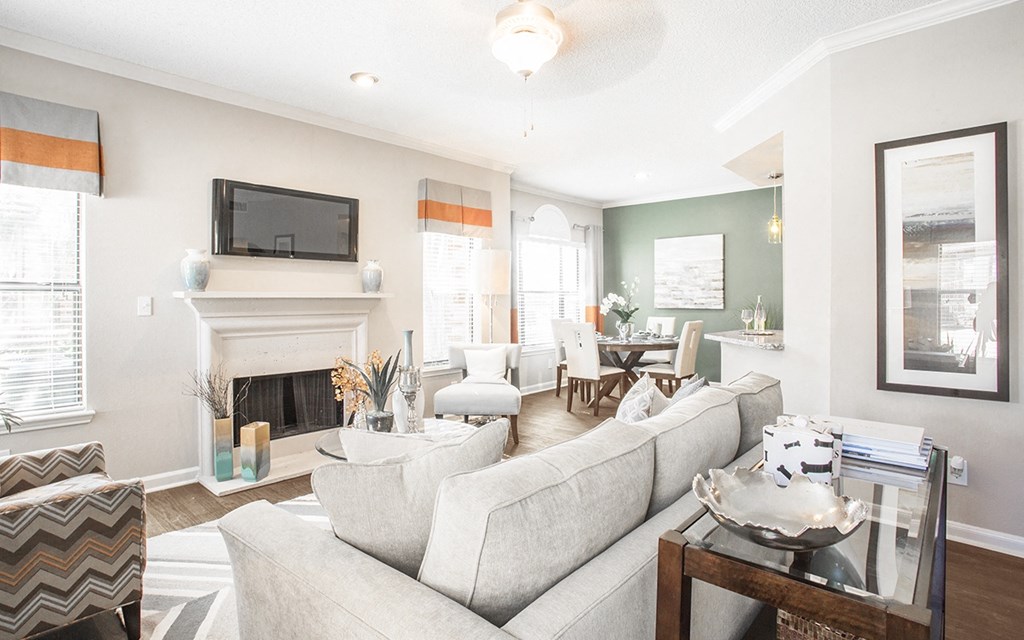 a living room with a fireplace and a couch