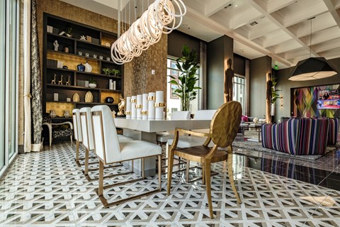 a dining room with a white table and chairs