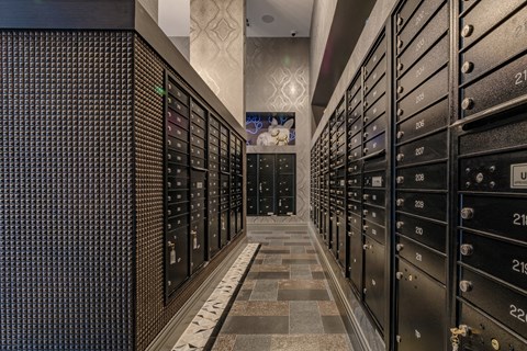 a long hallway of filing cabinets in a data center with a television in the background