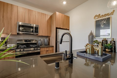 a kitchen with stainless steel appliances and a sink