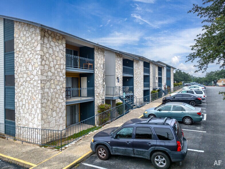 a building with cars parked in front of it