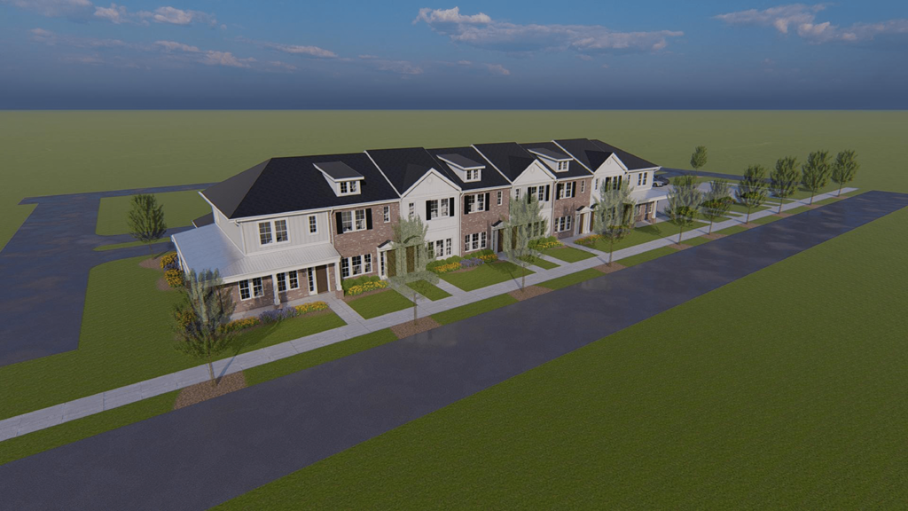 an aerial view of a large house with a road and a field