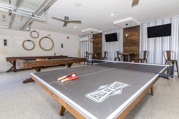 A ping pong table with the words Hall of Fame on it.