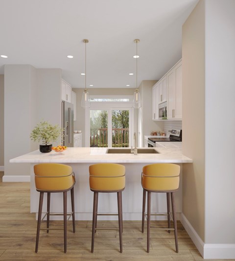 A kitchen with a white countertop and yellow bar stools.