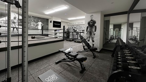 A gym with a boxing ring and a sign that says Ocean Center.
