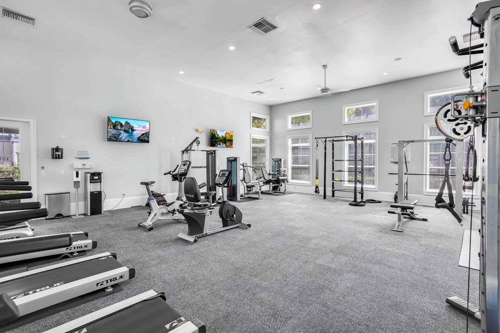 the gym is equipped with state of the art equipment including cardio machines and weights