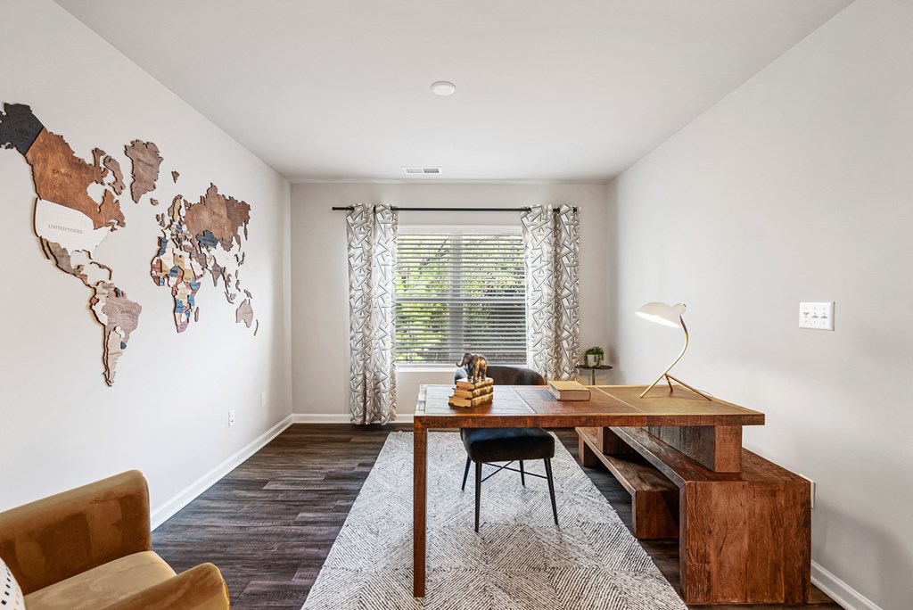 A room with a wooden table and a chair.