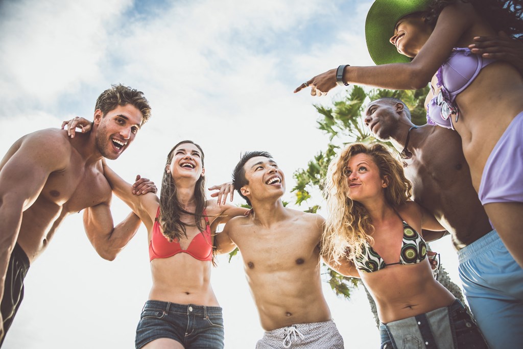 a group of friends hanging out at the beach