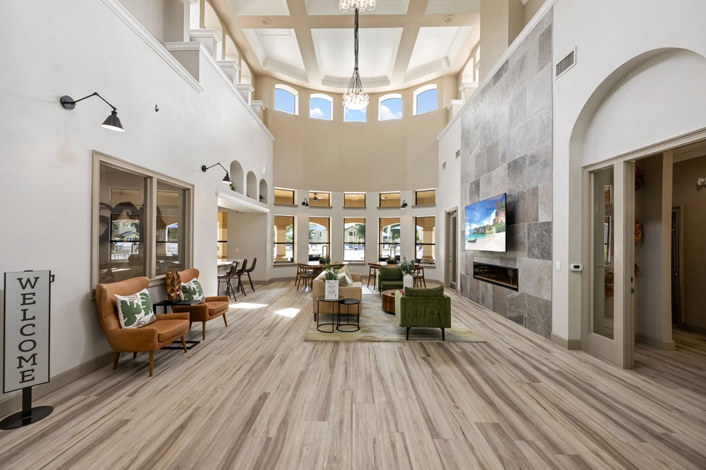 a large living room with furniture and a large fireplace