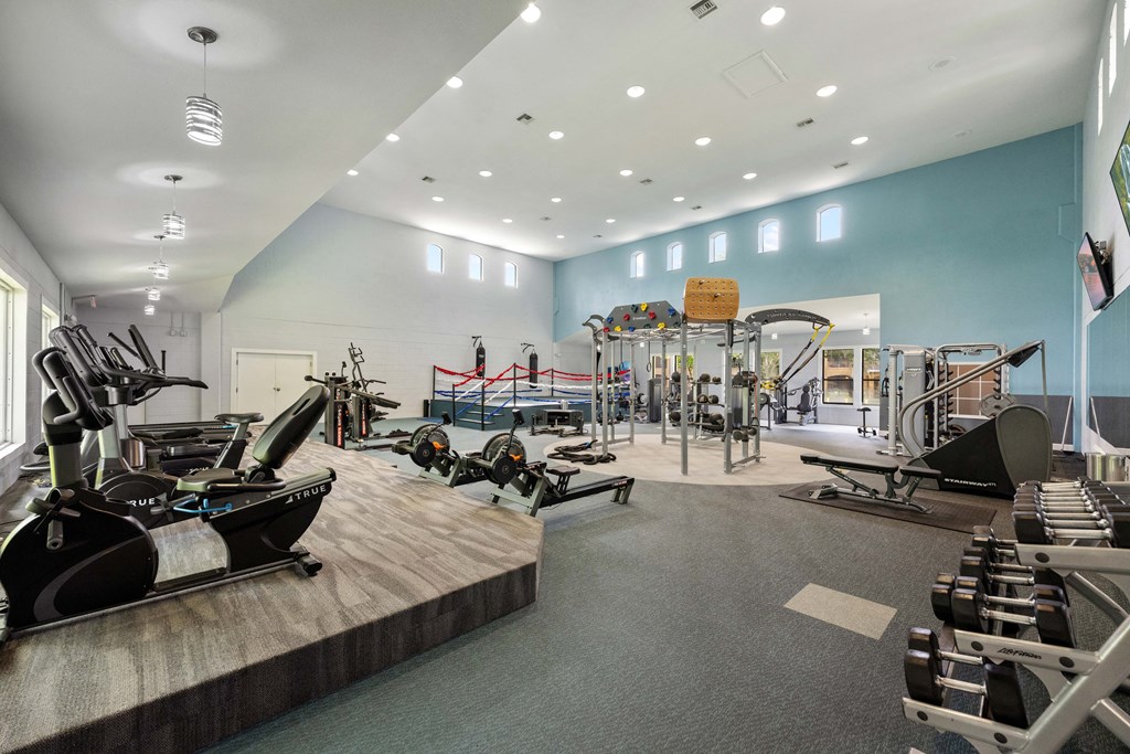 a gym with weights machines and other exercise equipment