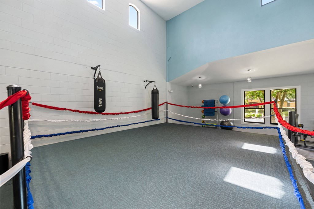 the weights room at the preserve at great pond apartments in great pond wi