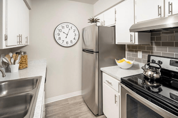 silver appliances with white cabinets - Photo Gallery 3