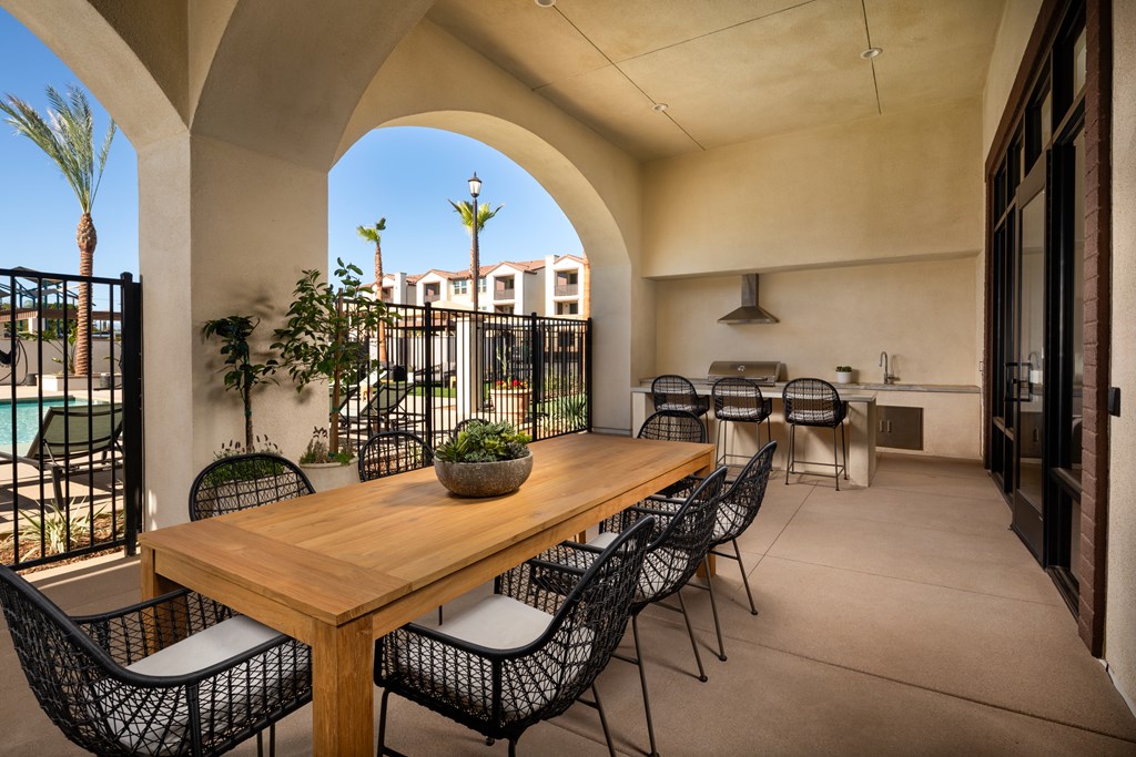 A patio with a table and chairs is shown.